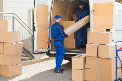 Removal team preparing a home move with safety precautions