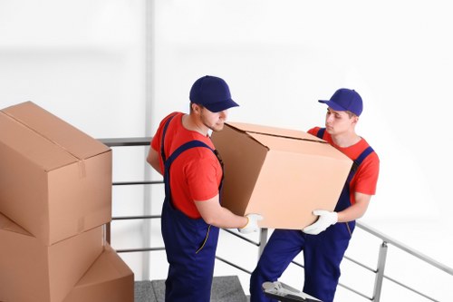 Workers and moving equipment representing ethical removals operations