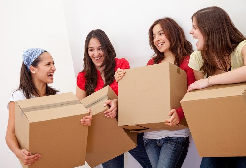 Organised office move with labelled boxes and workspace furniture
