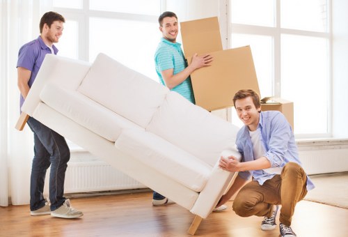 Boxes and furniture being handled during a move