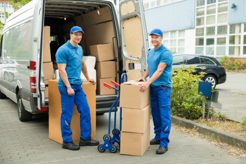 Local removal team transporting furniture in North London