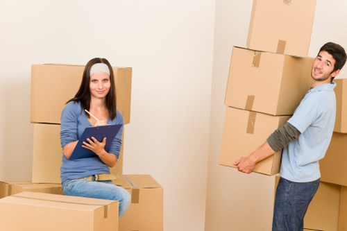 A local home removals team unloading boxes at a new property